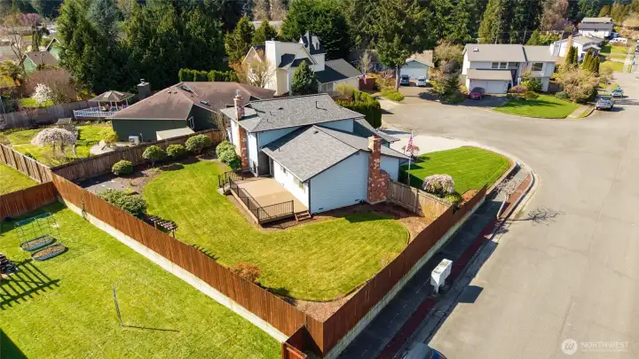 Ariel view of home on corner lot.