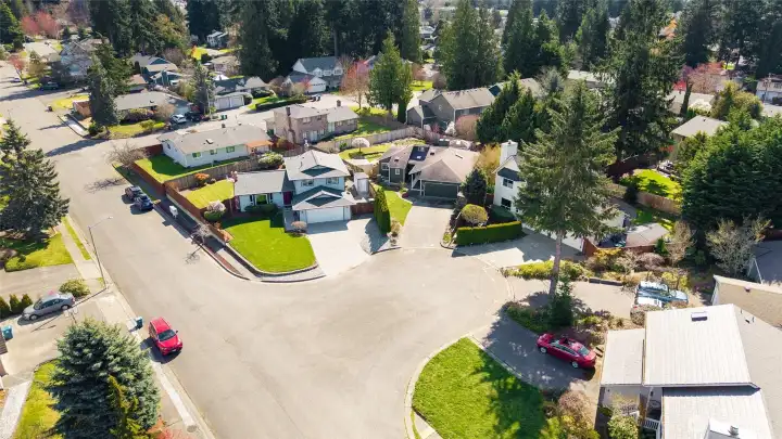 Ariel view of home on corner lot on cut-de-sac.