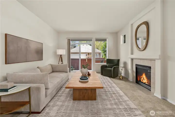 The living room features acces to the back patio and yard.