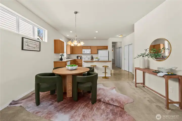 The dining area is open to the living room and kitchen