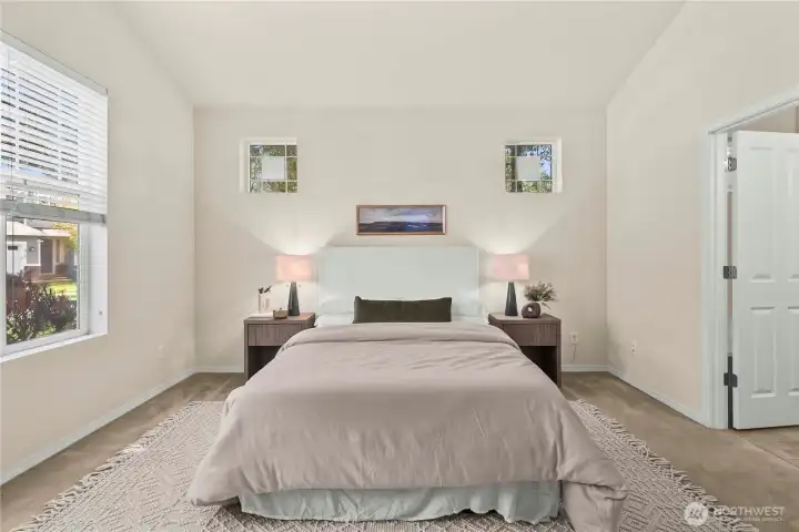 The spacious primary bedroom offers enough room to easily fit a king-sized bed.