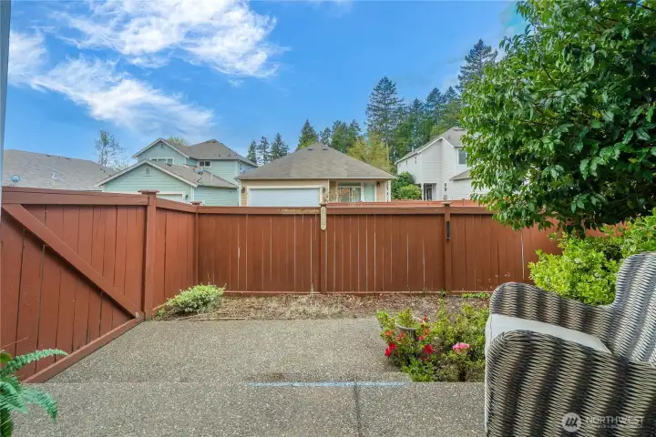 Enjoy the small, private and easy-to-maintain back yard with access gate to the driveway.