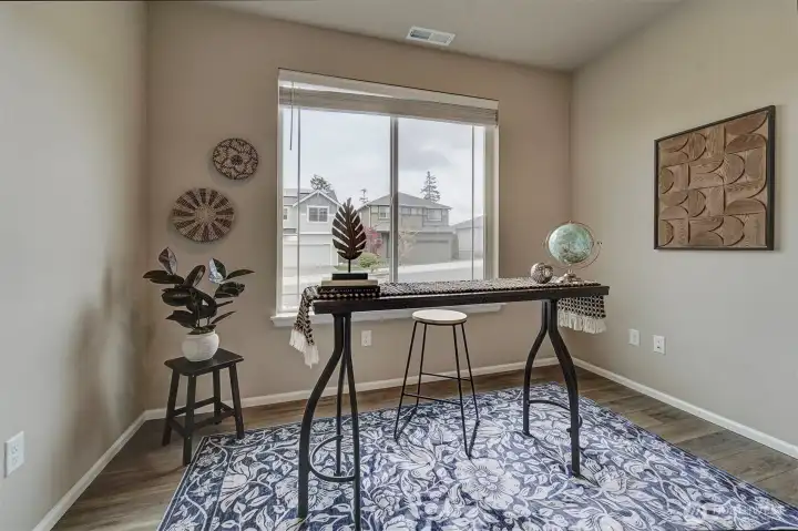 Keep the office as is - or select a wall and add built-ins for your personal library.