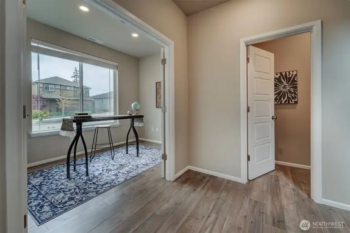Downstairs powder room is conveniently located off the office.
