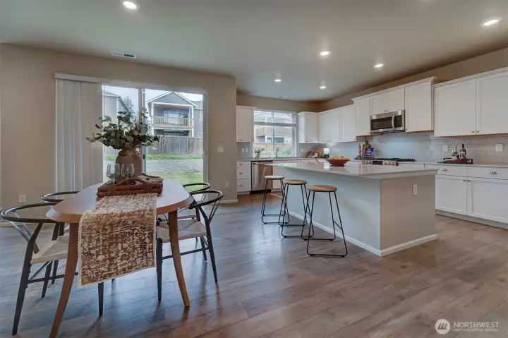 The large eating area can fit 4, 6, or even 8 at a formal table, and the large island provides additional informal sitting.