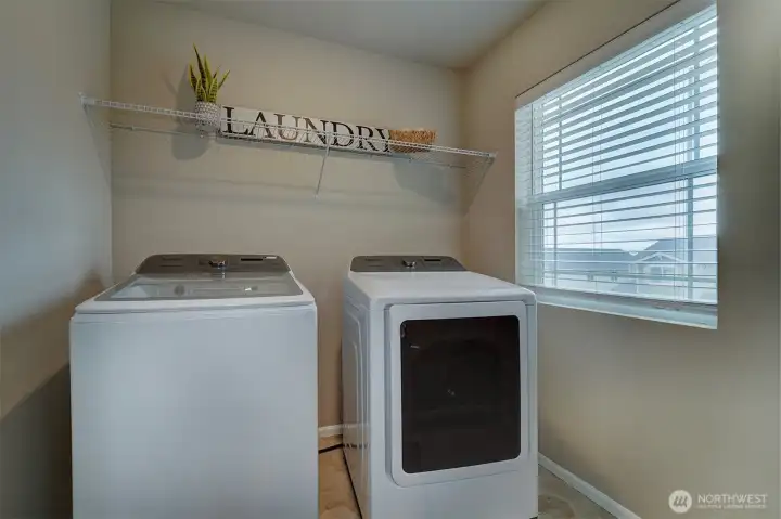 Upstairs laundry room with washer/dryer that stay with home.