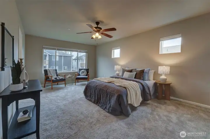 Primary bedroom is very spacious - totally fit for a king size bed + dressers and a sitting area.