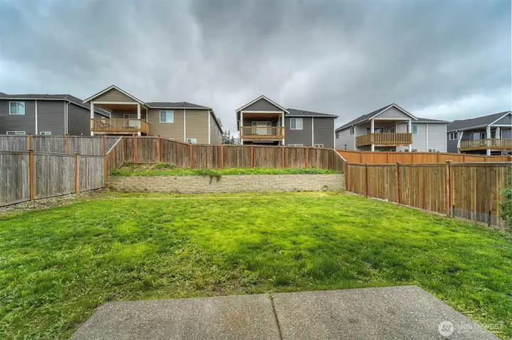 The backyard is a blank slate - gardening boxes, playset, firepit, covered patio - the sky is the limit.