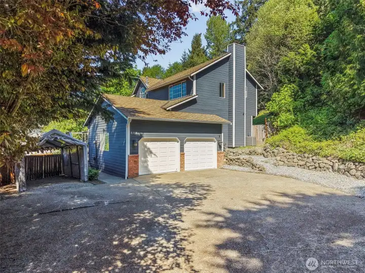 Two car garage and detached car port.