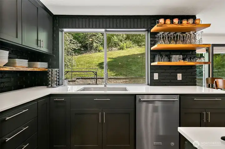 Kitchen with black brick accents.