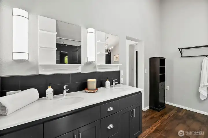 Double sink and mirror in primary bathroom.