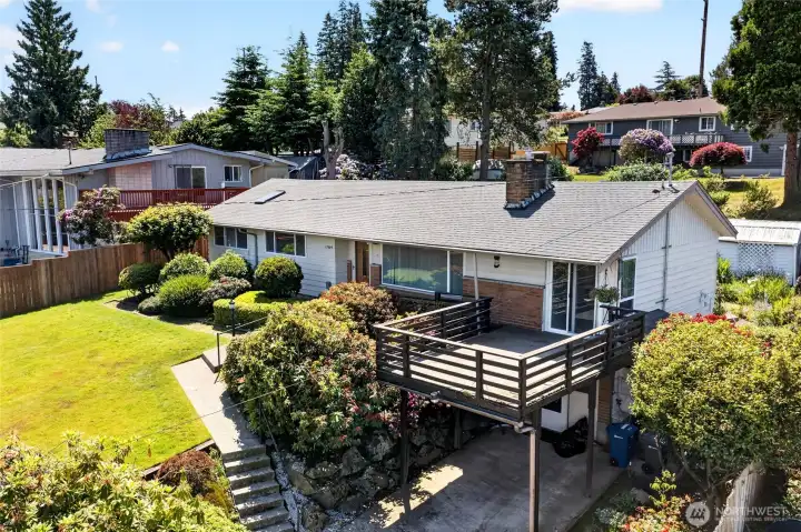 Large Picture window, Deck and carport.