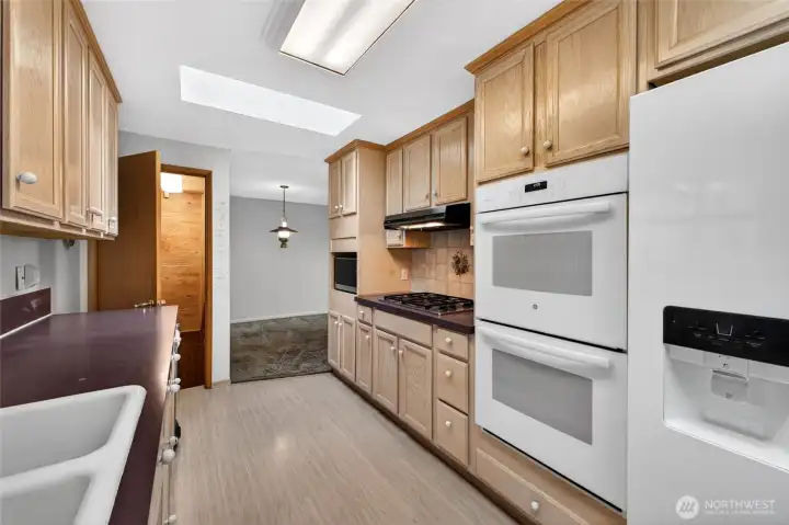 Kitchen with plenty of counter space and Gas Cook Top . Skylight