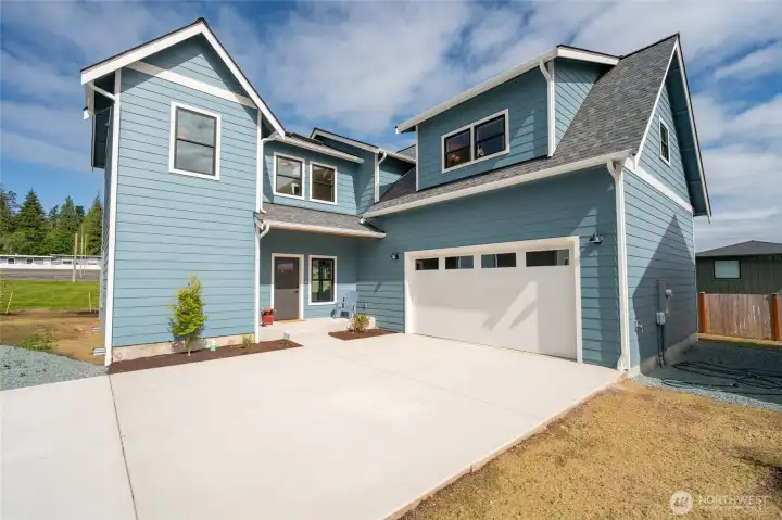 Exterior of house and driveway to 2-car garage