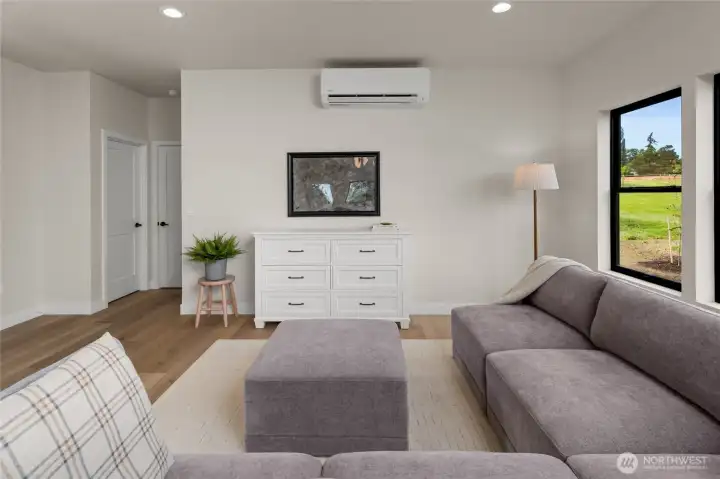 Living room with bathroom and bedroom access to the far left