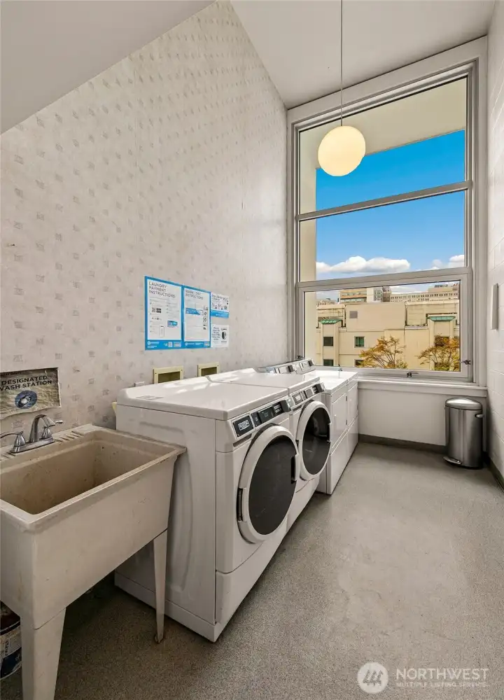Laundry room with city outlook