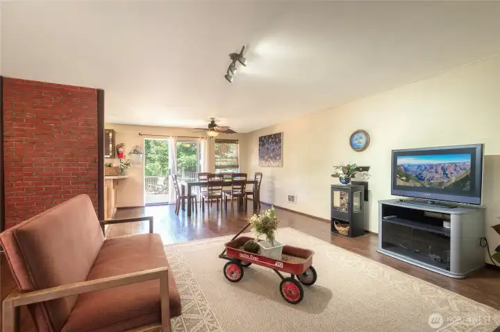 Warm, inviting open-concept living filled with natural light. Consistent flooring throughout the home w/exception of kitchen & bathroom. Warm, inviting open-concept living filled with natural light. Consistent flooring throughout the home w/exception of kitchen & bathroom.