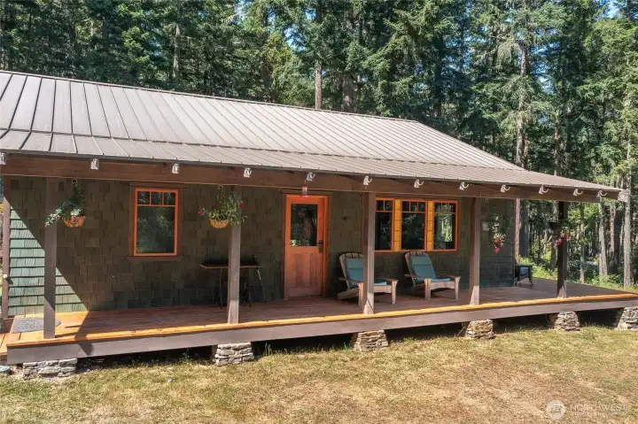 Front entrance invites you to sit a spell and relax. Stop, listen and take in the forest hug you get when you are present in this space. Front entrance invites you to sit a spell and relax. Stop, listen and take in the forest hug you get when you are present in this space.