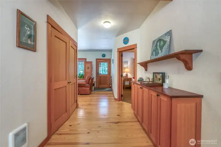 Looking from the dining area towards front door. Custom cabinets throughout, fir and mahogany. French doors open up to laundry room and hot water heater. Looking from the dining area towards front door. Custom cabinets throughout, fir and mahogany. French doors open up to laundry room and hot water heater.