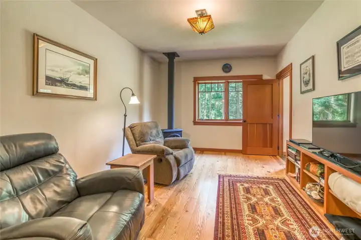 Bonus room offers flex space, wood stove keeps it cozy. Bonus room offers flex space, wood stove keeps it cozy.