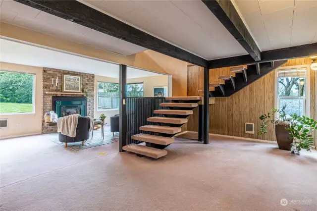 This home features an unusual stairwell and exposed beams. This gives this home a feel that you will not find anywhere else.