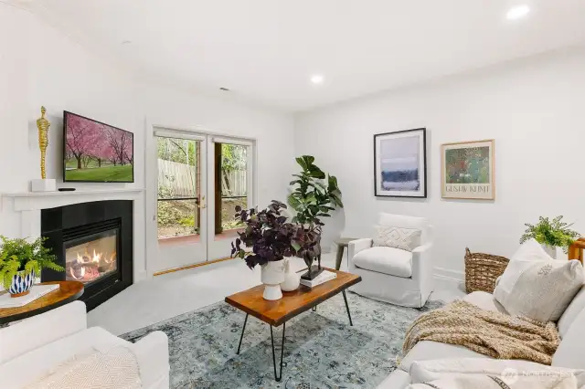 Spacious and cozy living area with french doors to deck. Fence is scheduled to be replaced.