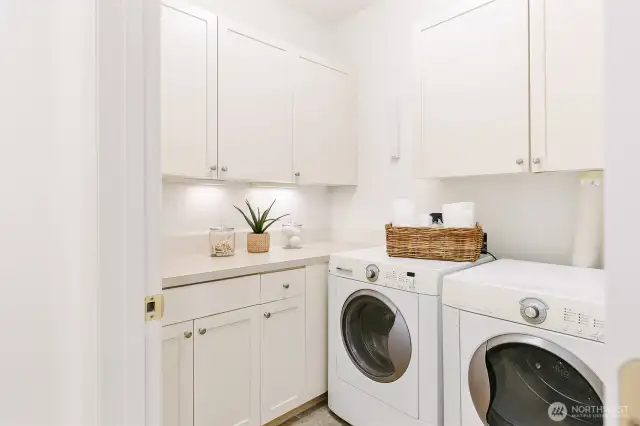 Laundry room with more storage.