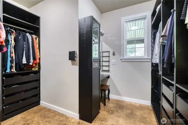 Extra large walk-in closet in primary bedroom.