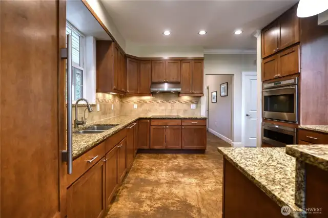 Sub-Zero fridge in the kitchen, Wolf double convection oven and Wolf drawer style built in microwave.