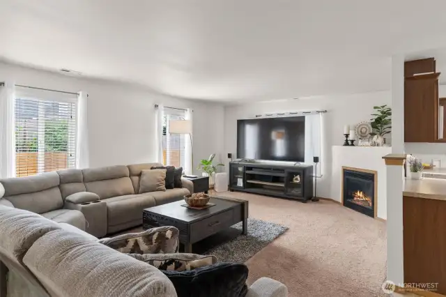 Gas fireplace, living room open to kitchen on the right