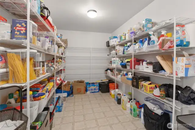 Expansive pantry!  Pantry leads to the large 2 car garage.  Also being used partially as a mudroom for shoes, backpacks, coats on the way in the door.