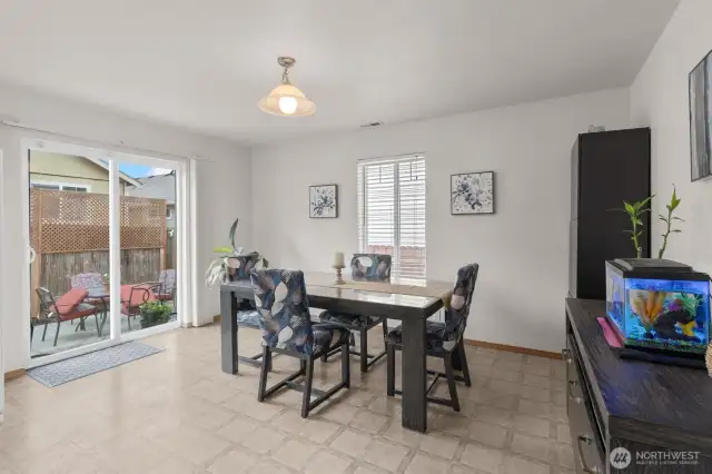 Dining area and slider to the backyard.