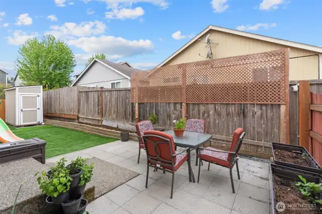Relax and enjoy in your low maintenance backyard.  Astro turf, pavers and new shed!