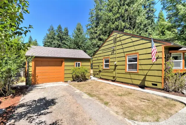 Deep driveway for off-street parking. Automatic garage door.