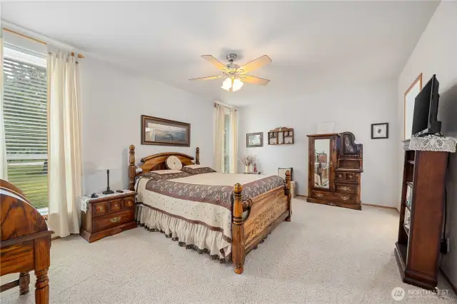 The main bedroom is across the from the house from the two guests rooms. Large with walk in closet and walk in shower for a 3/4 bathroom.