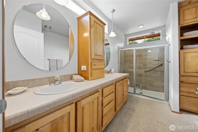 Main bath with walk in shower and tons of storage.