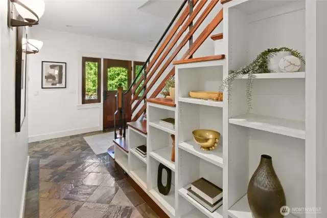 Lovely built-in shelving follow the lines of the stairway