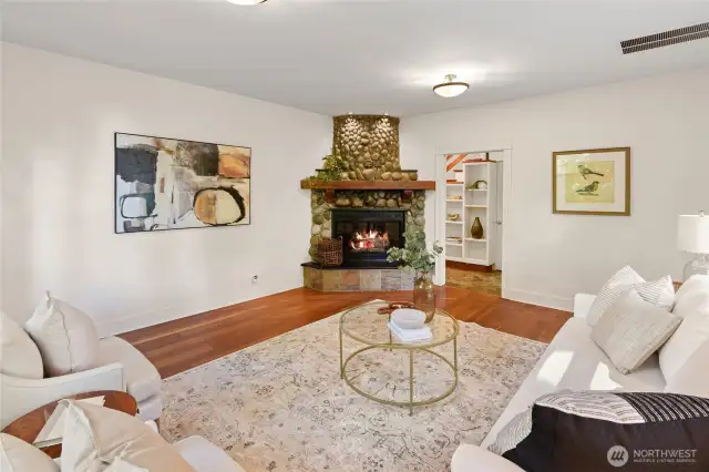 Living room features river rock fireplace - currently propane. Can convert to wood if desired
