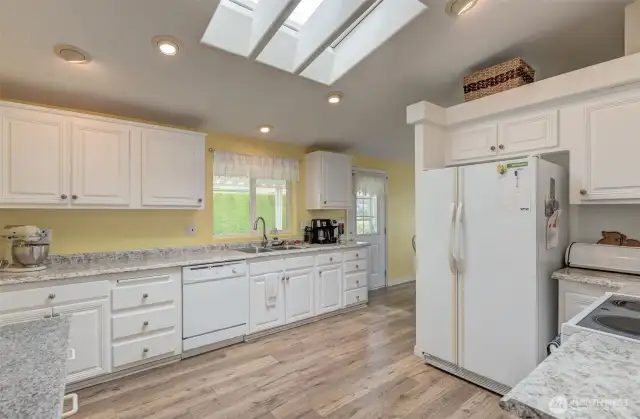 Imagine putting all this counterspace to use in this bright, beautiful Kitchen!