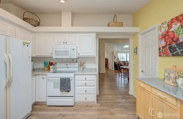 So much storage and work space in this kitchen! (door to the right is a WALK-IN PANTRY!)