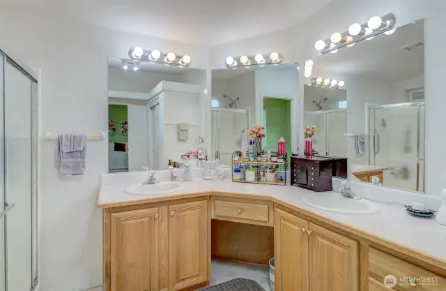 Primary bathroom offers a double vanity, oversized walk-in shower, and full-size linen closet!