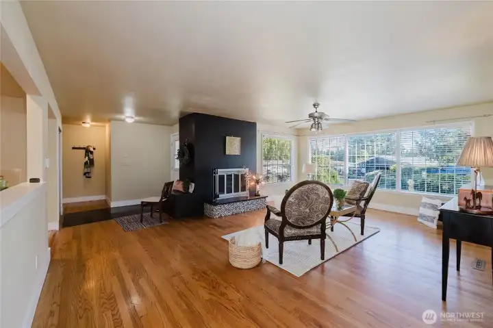 Livingroom w/ hardwood floors, fireplace, and natural light