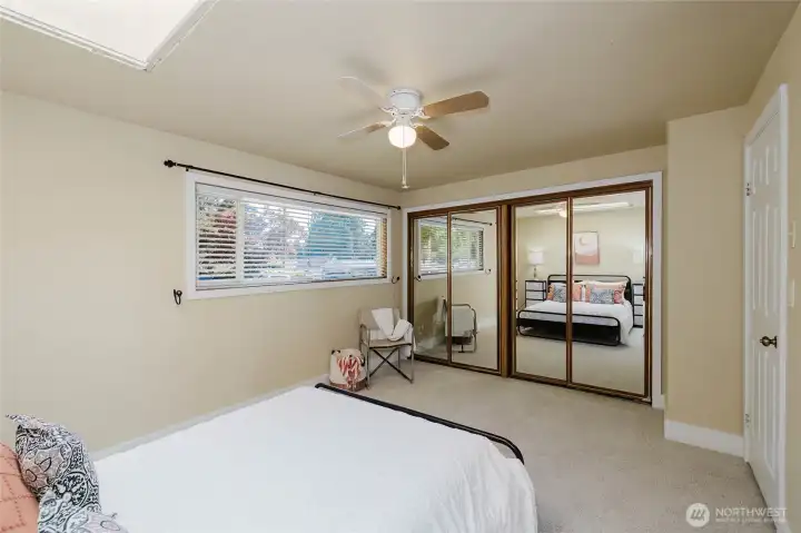 Primary bedroom with a double closet