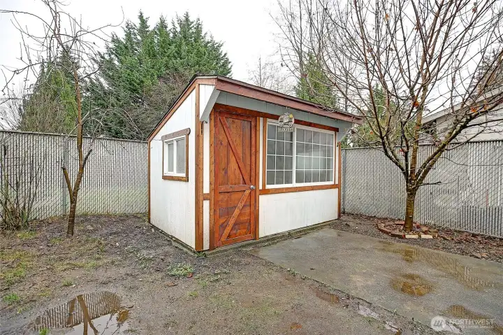 Gardeners/storage shed located in the courtyard.