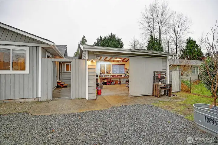 Generous detached garage w/benches and plenty of room for tools