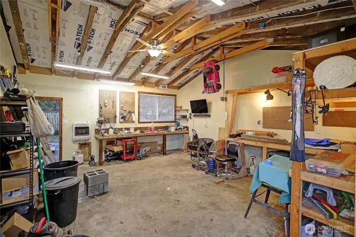 Interior of detached garage lots of benches and work space