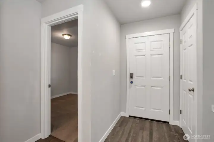 entry with coat closet and front bedroom