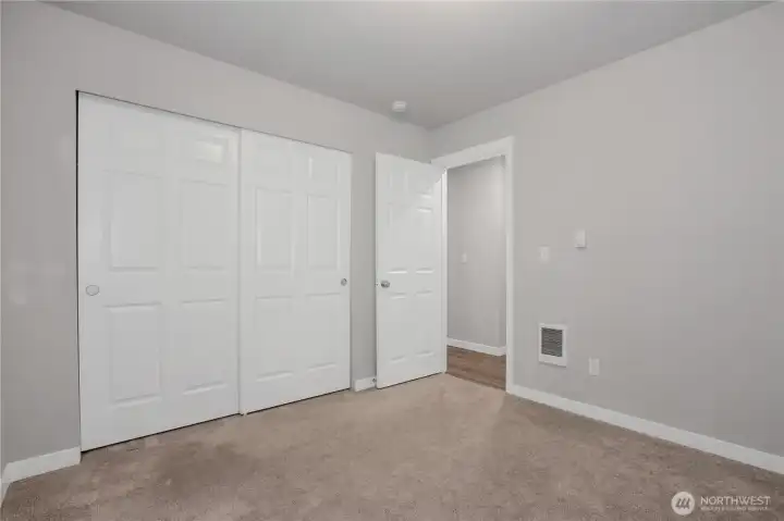 Bedroom #2 with double door reach-in closet