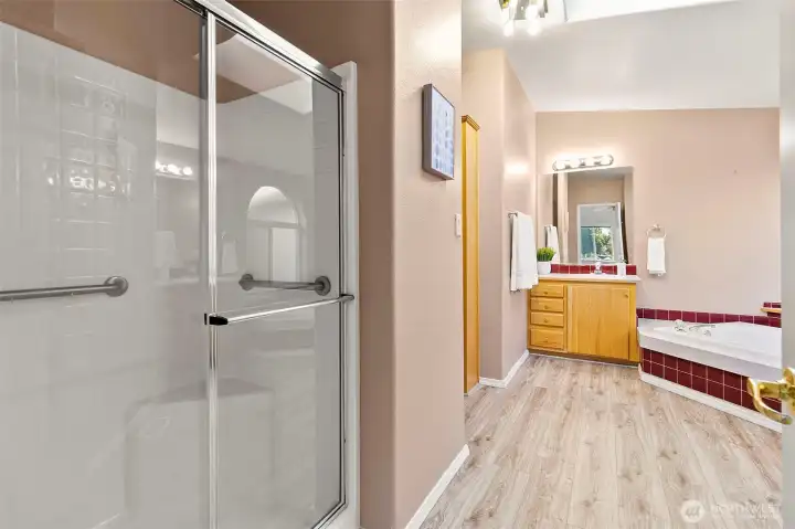 Walk in shower and a jetted soaker tub.