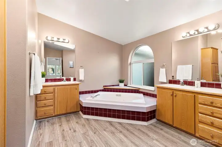 Double vanities and a jetted tub make this feel like a spa